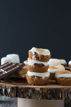 there are several desserts on the table with marshmallows and graham crackers