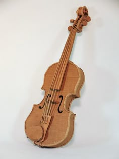 a violin made out of wood on a white background