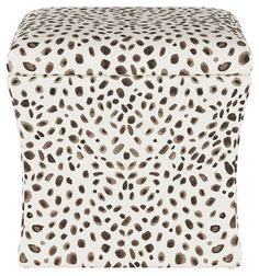 a white and brown animal print ottoman