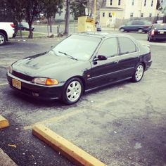 a black car parked in a parking lot