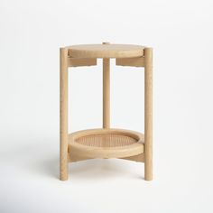 a wooden table with a basket on the bottom and one shelf below it that is made out of wood