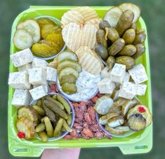 a green tray filled with different types of snacks