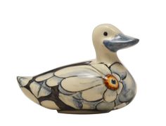 a ceramic duck with an orange eye on it's head and flowers painted on its body