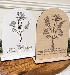 two wooden plaques with flowers on them