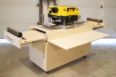 a workbench with tools on top of it in a garage or office area