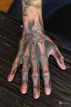 Tattoo Ideas For Men Bone Hand Tattoo, Skeleton Hand Tattoos, Arm Tattoos For Guys Forearm, Best Neck Tattoos, Smile Tattoo, Bone Hand, Skull Hand Tattoo, Skeleton Tattoo, Rose Tattoos For Men