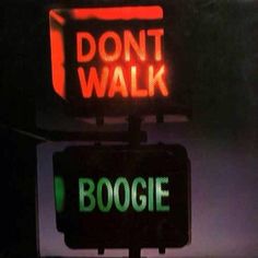 a neon sign that says don't walk and boogie