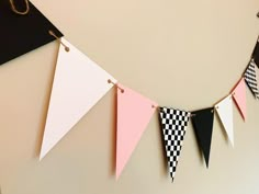 a black and white checkered pennant hanging from a wall