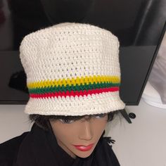 Handmade Crotchet Hat. Acrylic. Stretchy. White W/(Red Green Gold). Unisex. New. Adult Fit. One Size Fits Most. Yellow (Gold). Black Hat Sold Separately. White One Size Bucket Hat For Vacation, White One-size Bucket Hat For Vacation, White One Size Bucket Hat For The Beach, White Cotton Bucket Hat One Size, White Cotton Vacation Hat, White One Size Bucket Hat, Adjustable White Crochet Bucket Hat, White Adjustable Crochet Bucket Hat, White Crochet Hat For Vacation