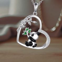 The pendant showcases a cute panda nestled within a heart-shaped frame, symbolizing peace and love, crafted with exquisite detail. Made from premium 925 sterling silver, this necklace is both durable and sturdy, perfect for daily wear. The panda pendant measures 29.4mm in height and 22.4mm in width, paired with an adjustable 18+2 inches silver chain for a comfortable and customizable fit. Red Panda Jewelry, Bear Design Pendant Jewelry Gift, Panda Pendant, Bear Pendant Necklace, Heart Shaped Frame, Bear Necklace, Cute Panda, Animal Jewelry, Peace And Love