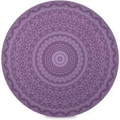 a purple rug with an intricate design on the top and bottom, it's circular shape