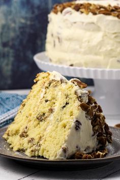 a slice of cake on a plate with pecans