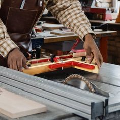 a man working on a piece of wood