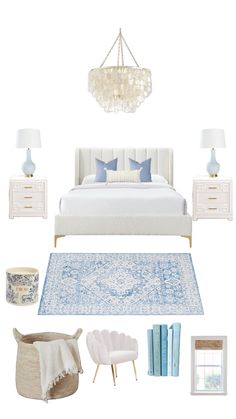 a white bedroom with blue accents and accessories on the floor, including a chandelier