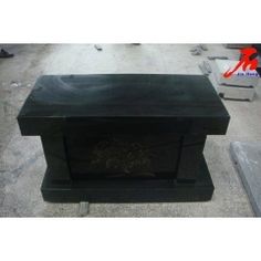 a black box sitting on top of cement