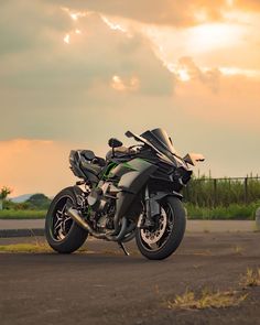 the motorcycle is parked on the side of the road