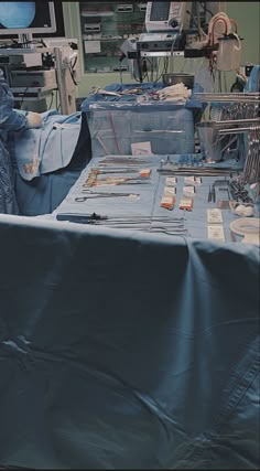 an operating room with surgical equipment on the table