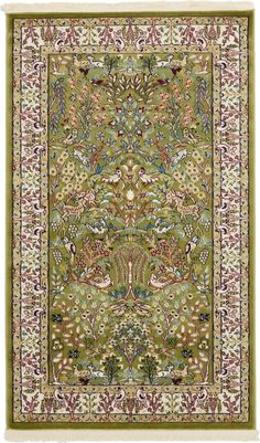 a green rug with an ornate design on the bottom and sides, in various colors