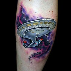 a tattoo with a space ship on it