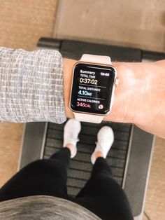 a person wearing an apple watch on their wrist with the time displayed in front of them