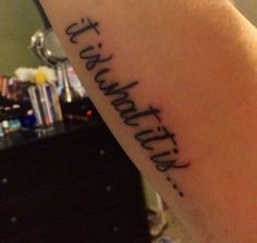 a person with a tattoo on their arm that says, faith is the most important thing