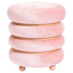 three pink cushions stacked on top of each other