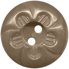 a round metal object with four holes in the center and two flowers on each side