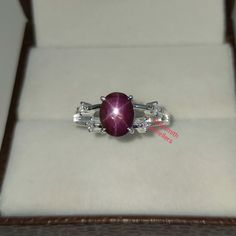 Band : Goldsmith Jewellers Material : 925 Sterling Silver Gemstone : 100% Natural Star Ruby Star Ruby Stone Weight : 3.15  Carat Star Ruby Stone Size : 6.87 x 8.70 MM Secondary Stone : Cubic Zirconia Zirconia Stone Weight : 0.16 Carat Zirconia Stone Size : 2.20 MM Gross Weight : 3.420 Gm Stone Shape : Oval, Round Stone Color : Red & White Ring Size : All Size Available Made to Order Please Give Your Opinion or Feedback About The Product https://www.etsy.com/in-en/your/shops/GoldsmithJewellers/onboarding/listings/create Star Ruby Ring, Ring Birthstone, Vintage Star, Star Ruby, Red Band, Ruby Stone, Star Ring, Women Ring, Ring Women