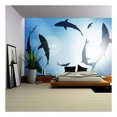 this is a bedroom with dolphins in the ocean