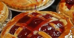 several pies with different toppings on top of each one, including cranberry sauce