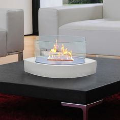 a fire pit sitting on top of a coffee table