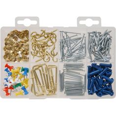 an assortment of screws, nuts and rivets in a plastic case on a white background