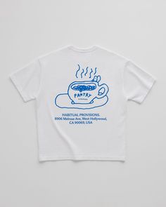 a white t - shirt with blue writing on the chest and a cup of coffee in it