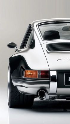 the rear end of a white porsche sports car