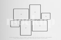 a white wall with four square frames on it