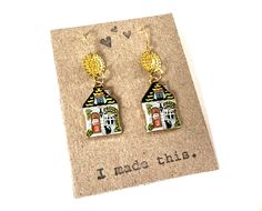 "Love these whimsical house earrings with a black cat! They will go with so many outfits and they are lightweight and pure fun! The charms and ear wires are gold toned and nickel free. I can swap out solid sterling ear wires for people with really sensitive ears. These earrings dangle about 1.25\" long. A great gift for that special someone who has everything! Check out my other mixed metal earrings! https://www.etsy.com/shop/HeidiKindFinds?ref=hdr_shop_menu&search_query=mixed+metal+earrings" House Earrings, Whimsical House, Mixed Metal Earrings, Colorful Home, Funky Earrings, Home Black, Funky Outfits, Repurposed Jewelry, Vintage Lettering