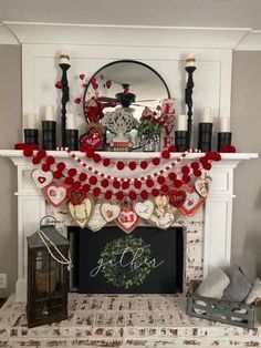 a fireplace decorated for valentine's day with red and white decorations