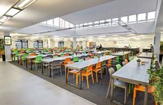 an empty library with many tables and chairs