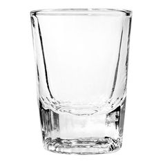 an empty shot glass on a white background