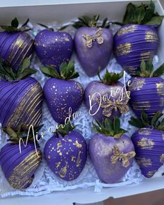 purple and gold strawberries in a box