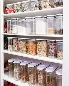 an organized pantry filled with lots of food and storage bins on the shelves above