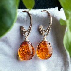 MORE AMBER EARRINGS - https://www.etsy.com/ie/shop/PreciousAmber?ref=hdr_shop_menu§ion_id=19068095 MATCHING PENDANT - COMING SOON Nature and beauty combined with an earthy pair of Amber earrings. Flawlessly crafted honey Baltic Amber pear-shaped teardrops set in 925 Hallmarked Silver. Lever-back closure ensures secure and carefree wear. Handcrafted to perfection they will make a meaningful nature-inspired gift or a wonderful love token for yourself or your special someone. Comes beautifully pres Small Drop Earrings, Earrings Teardrop, Amber Earrings, Luxury Gift Box, Amber Jewelry, Jewelry Women, Drop Earring, Baltic Amber, Tear Drop