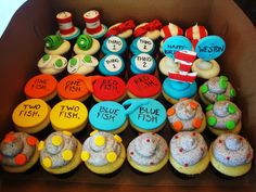 a box filled with lots of cupcakes covered in different types of frosting