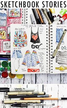 an open notebook with drawings and markers on it