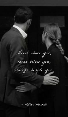 a man and woman standing next to each other in front of a door with the caption never above you never below you always beside you