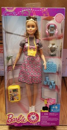 the doll is wearing a pink dress and yellow purse