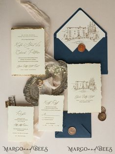 the wedding stationery is laid out on top of each other, including an envelope and two