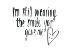 i'm still wearing the smile you gave me love quote on white paper with black ink