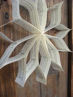 an origami flower made out of book pages