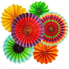 four different colored paper fans sitting next to each other